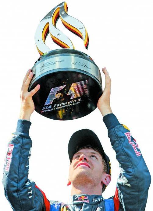 Sebastian Vettel strahlt nach seinem ersten Heimsieg. Foto: ap