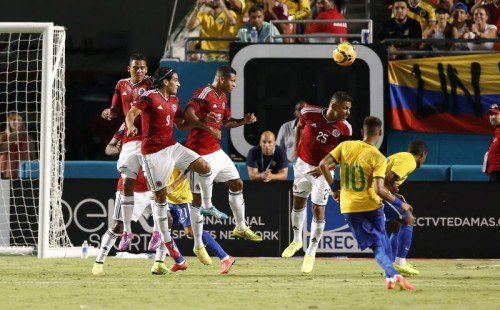 Sep 5, 2014; Miami Gardens, FL, USA; Brazil striker Neymar Junior (10) kicks the game winning goal against Columbia in the second half at Sun Life Stadium. Brazil won 1-0. Mandatory Credit: Robert Mayer-USA TODAY Sports