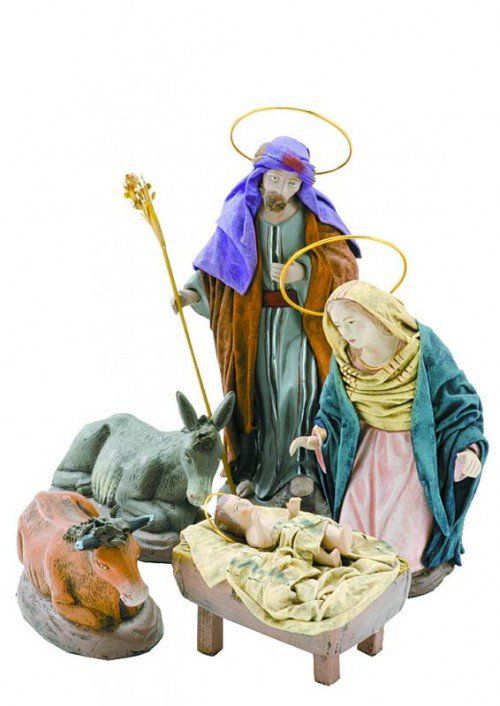Christmas Crib. Figures of Baby Jesus, Virgin Mary and St. Joseph on white background.