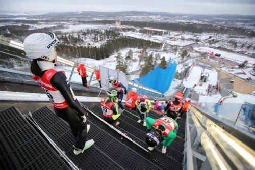 epaselect epa04625354 Sara Takanashi of Japan (L) and other ski jumpers prepare for a jump during a training session for the women's individual normal hill ski jumping competition at the FIS Nordic World Ski Championships in Falun, Sweden, 18 February 2015. The FIS Nordic World Ski Championships 2015 will take place in Falun from 18 February through 01 March 2015. EPA/FREDRIK VON ERICHSEN