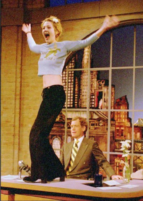 Actress Drew Barrymore dances on the desk of David Letterman during taping of CBS' "Late Show With David Letterman" Wednesday, April 12, 1995, in New York. ÄAP Photo/CBS, Alan SingerÜ