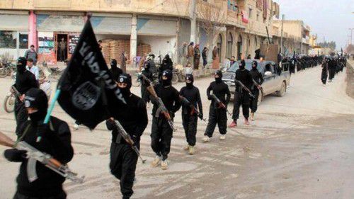 FILE - This undated file image posted on a militant website on Tuesday, Jan. 14, 2014, which has been verified and is consistent with other AP reporting, shows fighters from the al-Qaida linked Islamic State of Iraq and the Levant (ISIL), now called the Islamic State group, marching in Raqqa, Syria. When Islamic State fighters routed Syrian government forces and took control of the ruins of Palmyra Thursday, May 21, 2015 morning, the ancient city became the latest archaeological heritage site to fall into the hands of the militant group. (Militant Website via AP, File)