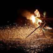 Fischen mit Netz und Feuerschein