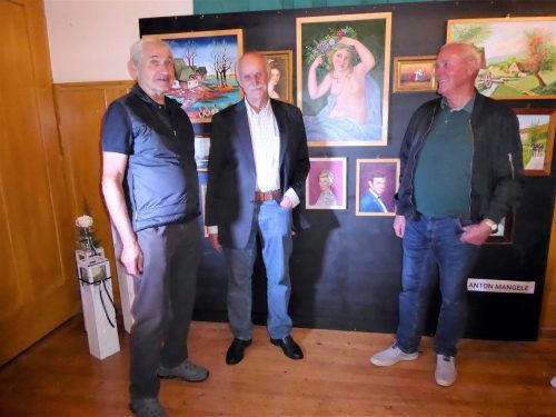 Anton Mangele (Mitte) mit Kollegen bei der Ausstellung.  MG Wolfurt