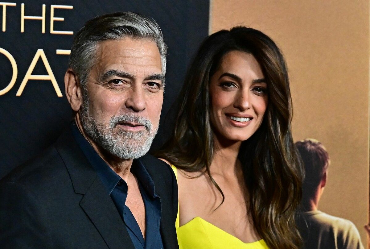 George Clooney mit seiner Frau Amal. ap